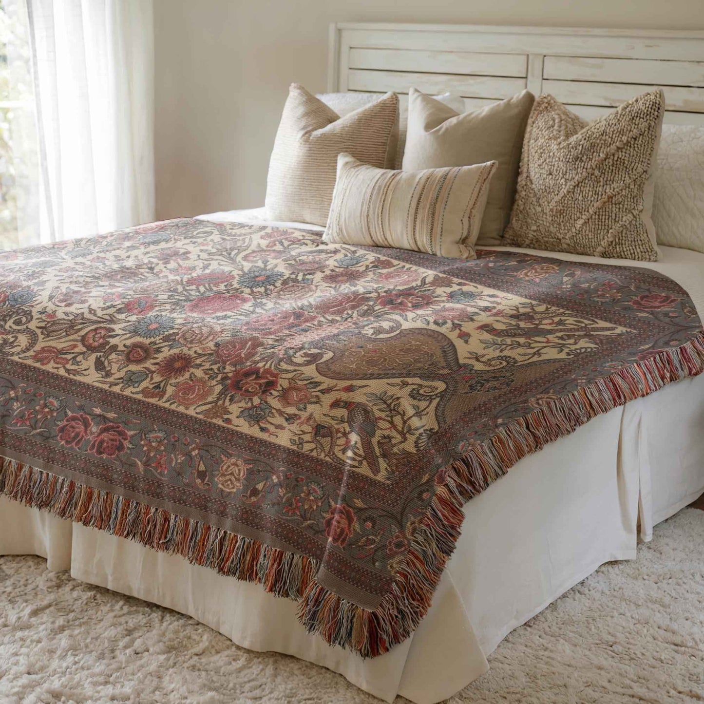 Moroccan Inspired woven blanket with floral pattern styled for layered home decor