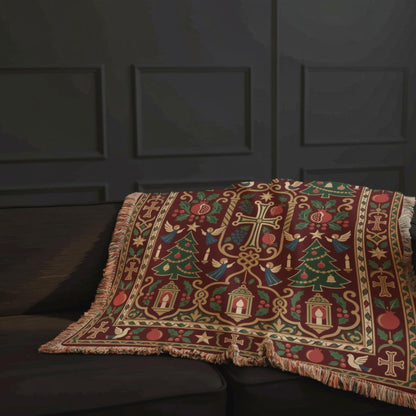 Armenian Christmas tree blanket draped over a sofa below a mantel with stockings and garland