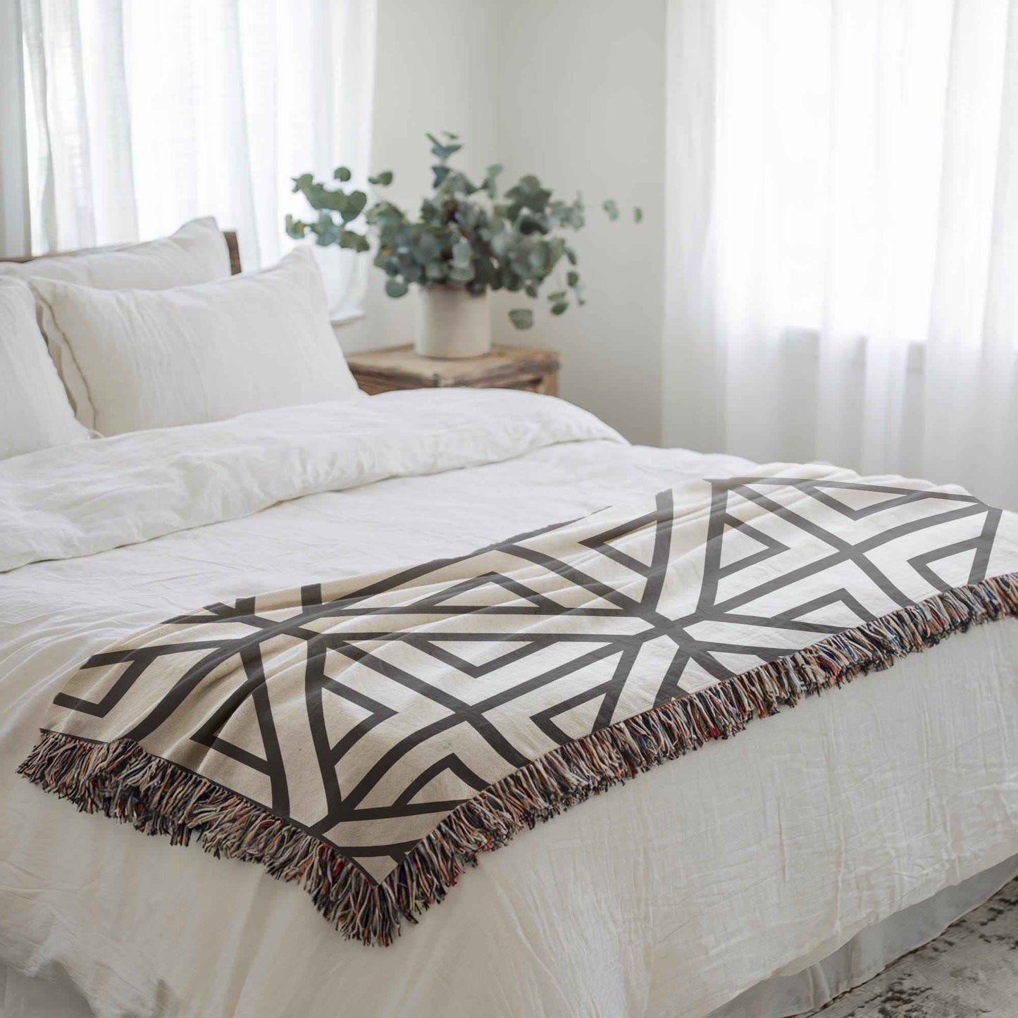 Modern Geometric woven blanket with geometric pattern styled for layered home decor
