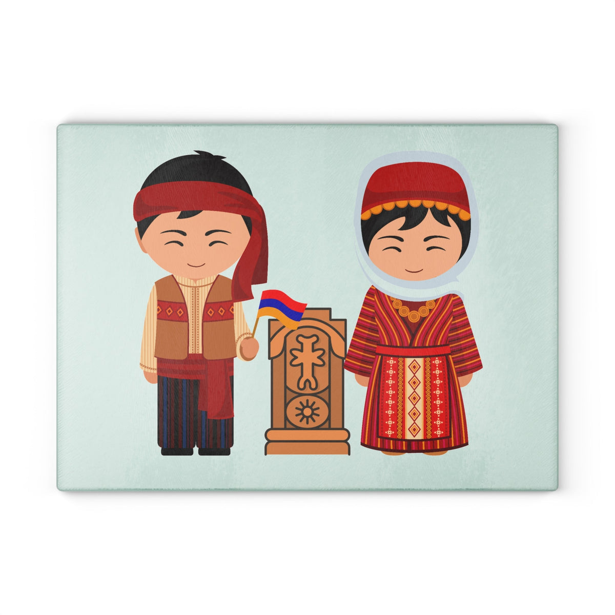 Khachkar cutting board with Armenian dress figures on a grey mat beside a knife and fresh herbs