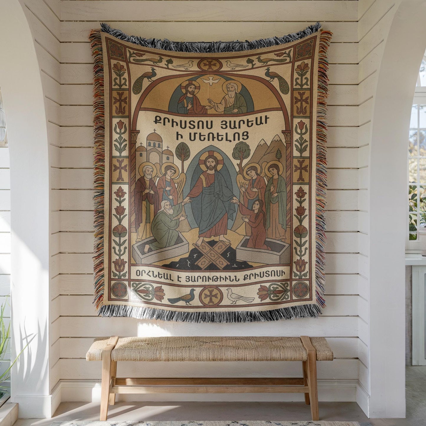 Full Virgin Mary wall tapestry hung on white shiplap above wooden bench, muted tan, rust, blue tones.