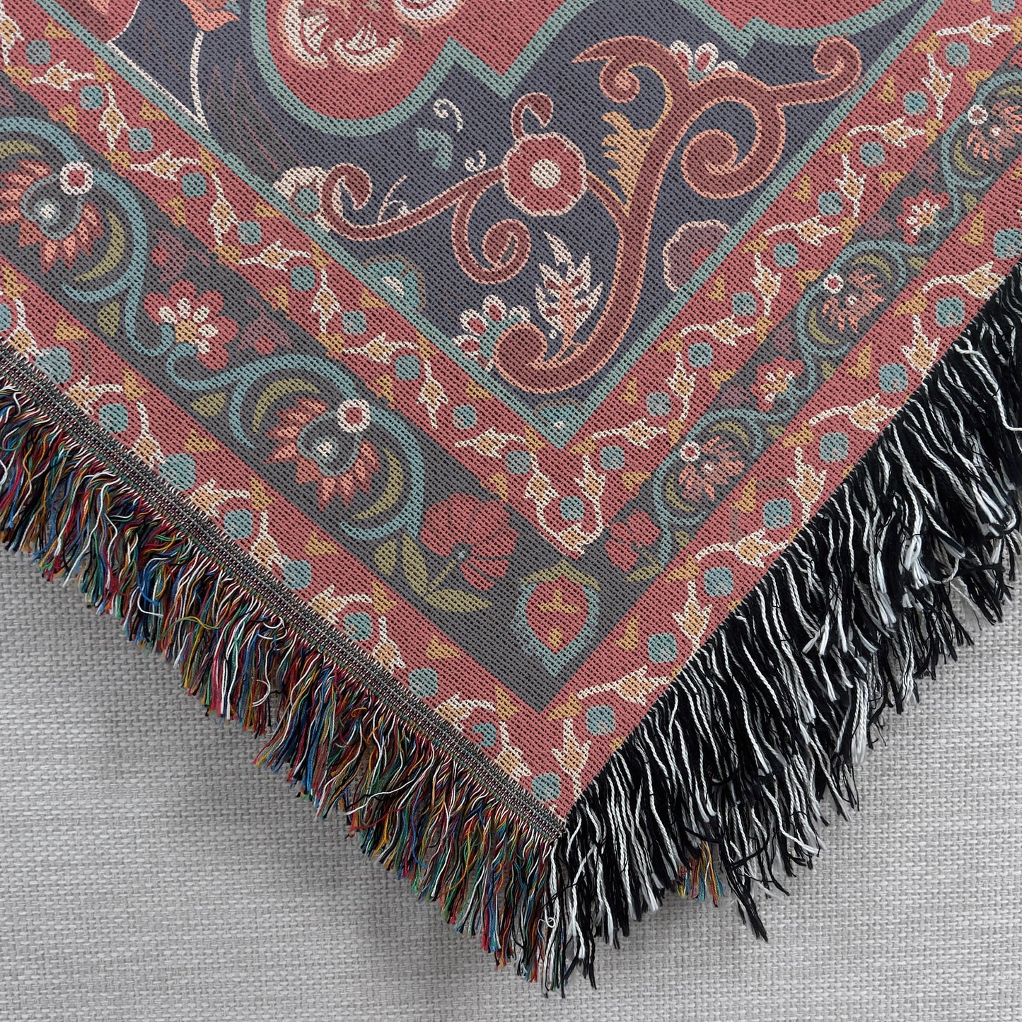 Caucasian Rug Inspired woven blanket with geometric pattern styled for layered home decor