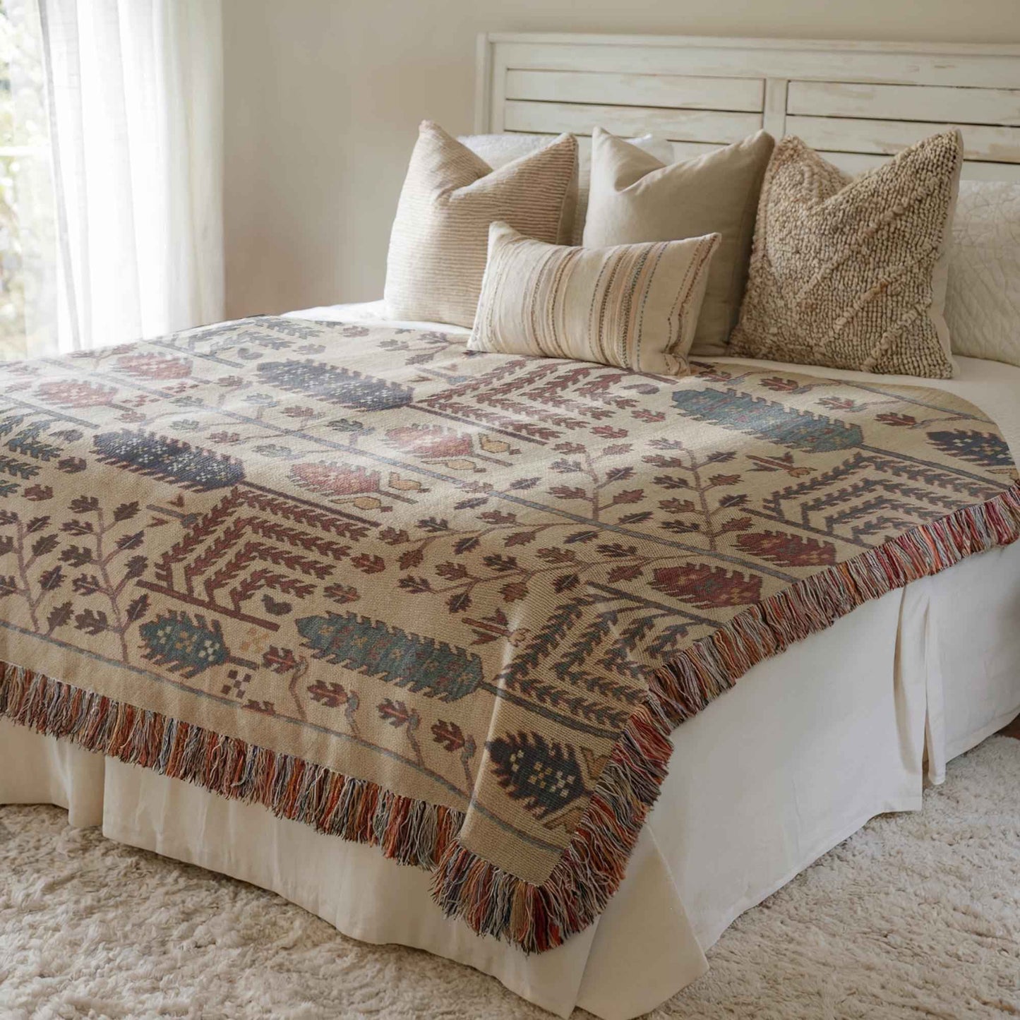 Anatolian Inspired woven blanket with rug-style pattern styled for layered home decor
