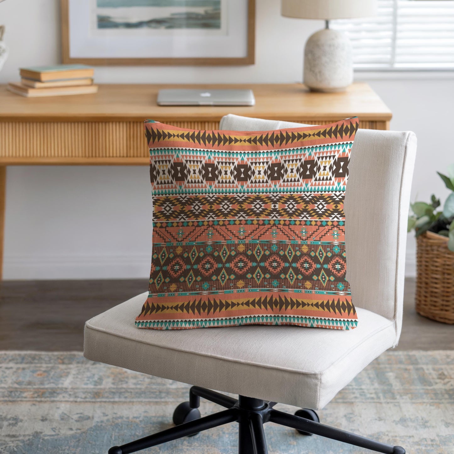Southwestern throw pillow with geometric pattern styled on a sofa or bed