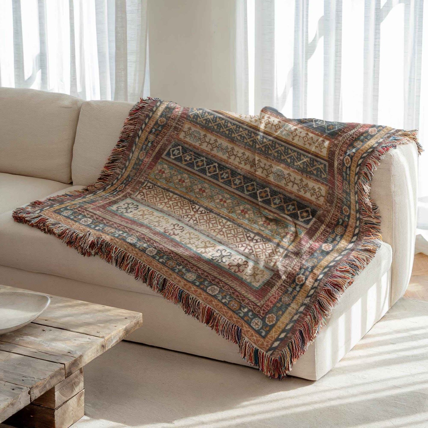 Southwestern woven blanket with geometric pattern styled for layered home decor