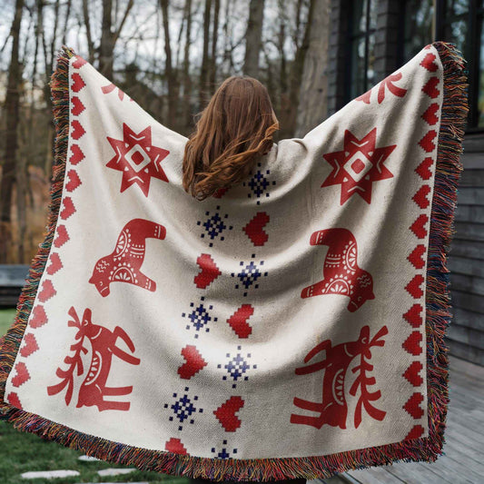 Scandinavian Inspired woven blanket with rug-style pattern styled for layered home decor