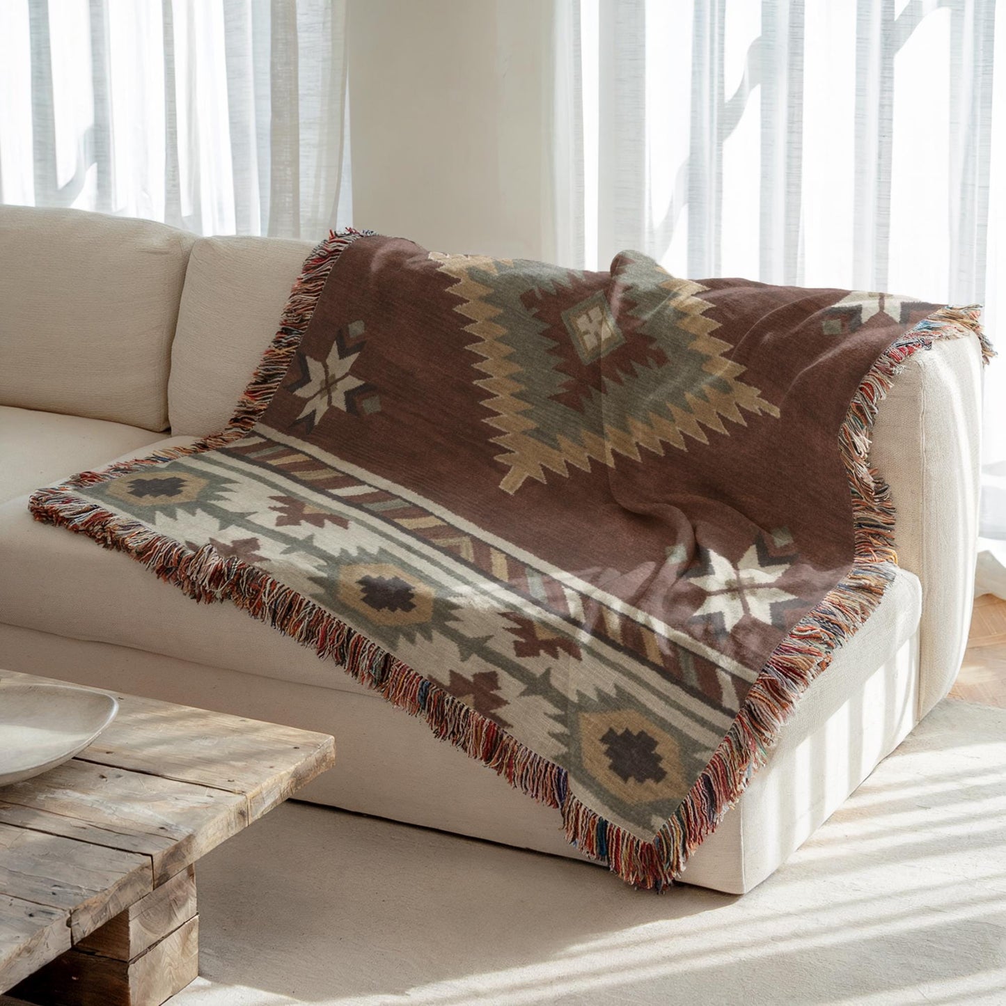 Southwestern woven blanket with geometric pattern styled for layered home decor