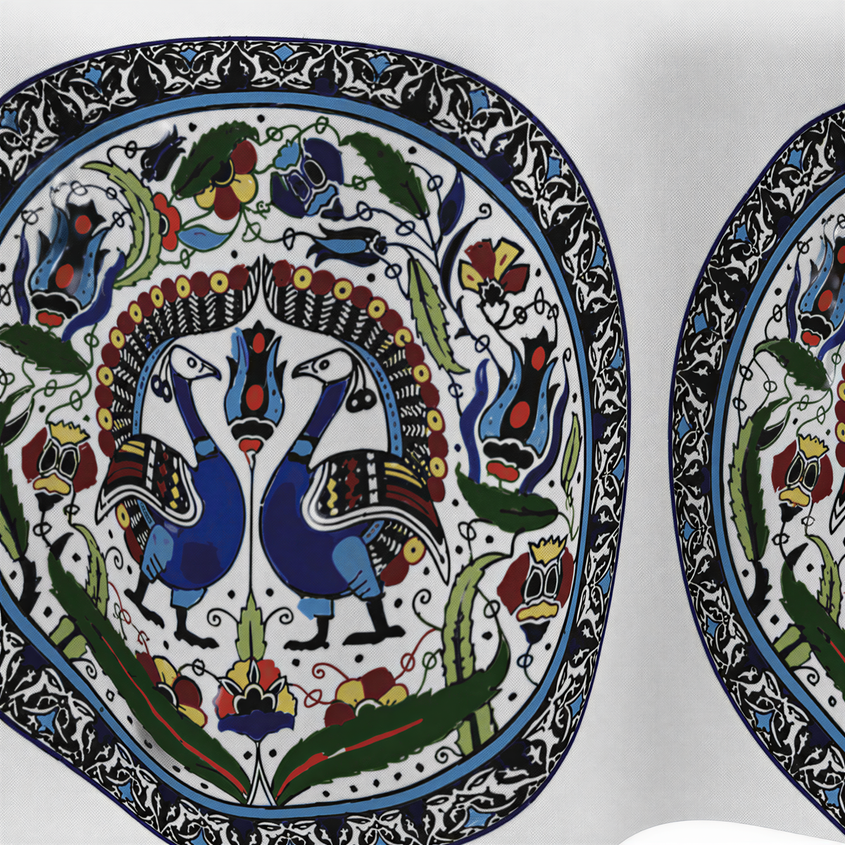 Close view of the oval medallions holding paired blue peacocks with green leaves