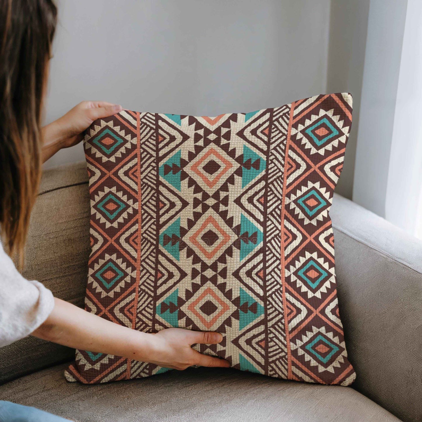 Southwestern pillow cover with geometric pattern styled on a sofa or bed