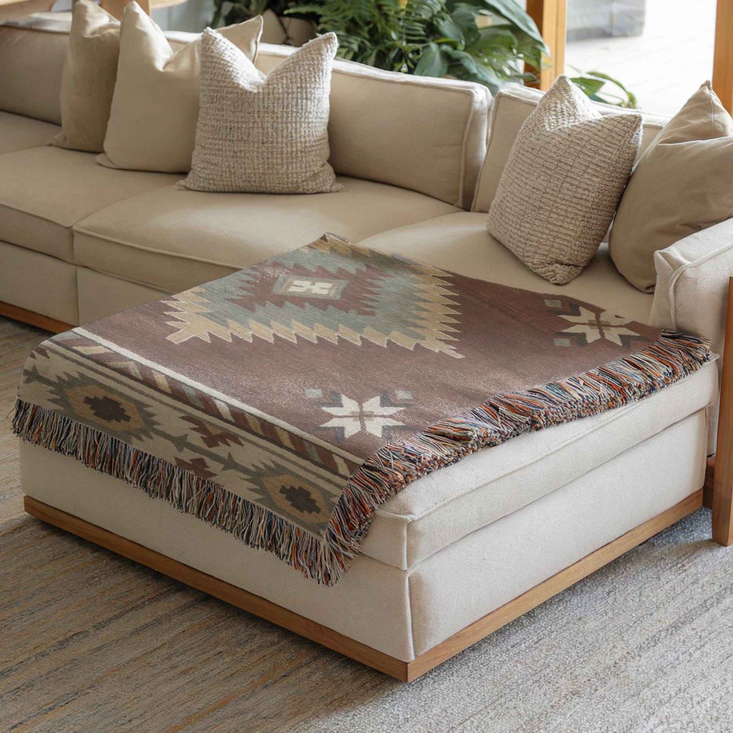 Southwestern woven blanket with geometric pattern styled for layered home decor