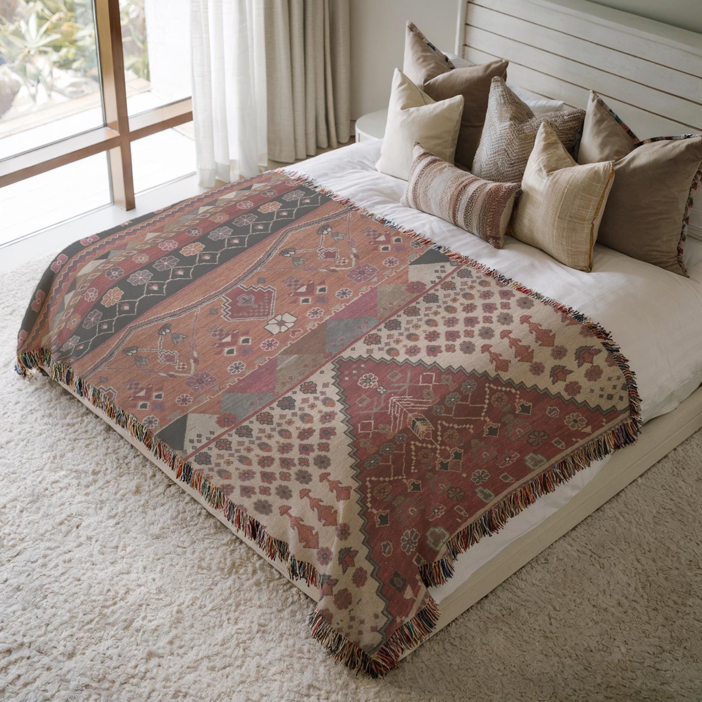 Southwestern woven blanket with geometric pattern styled for layered home decor