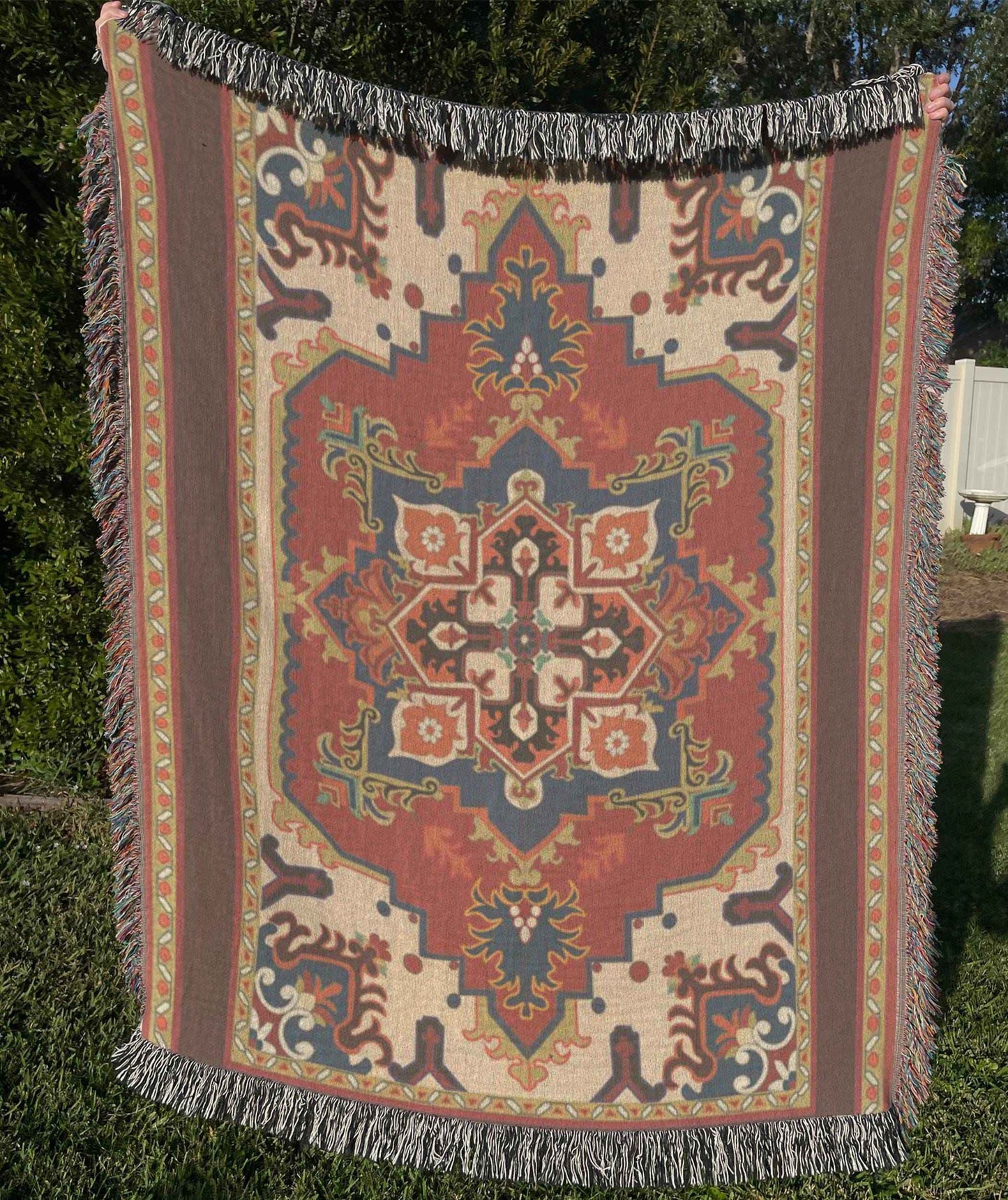 Moroccan Inspired woven blanket with rug-style pattern styled for layered home decor