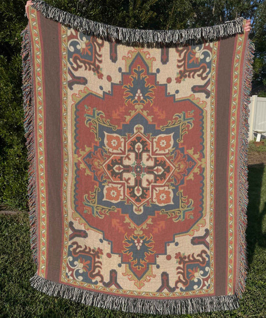 Moroccan Inspired woven blanket with rug-style pattern styled for layered home decor