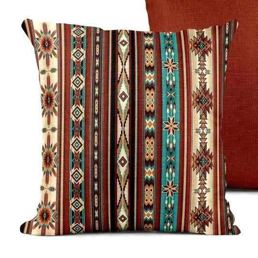 Southwestern throw pillow with geometric pattern styled on a sofa or bed