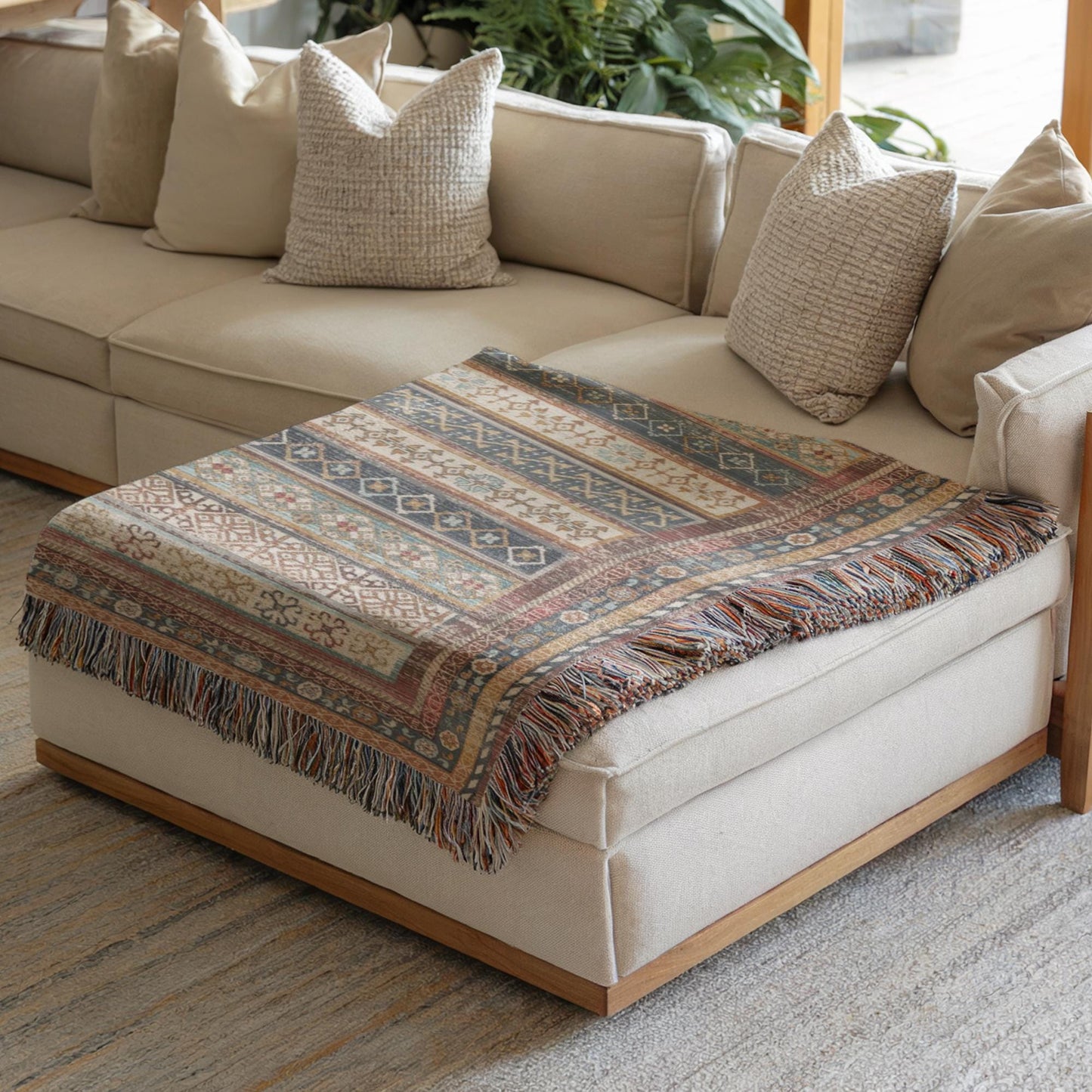 Southwestern woven blanket with geometric pattern styled for layered home decor