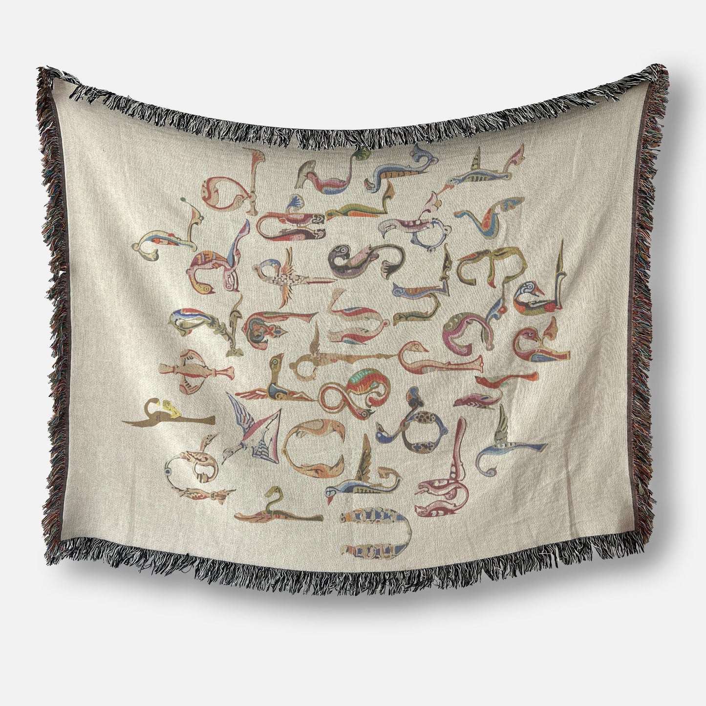 Boho woven blanket with woven pattern styled for layered home decor