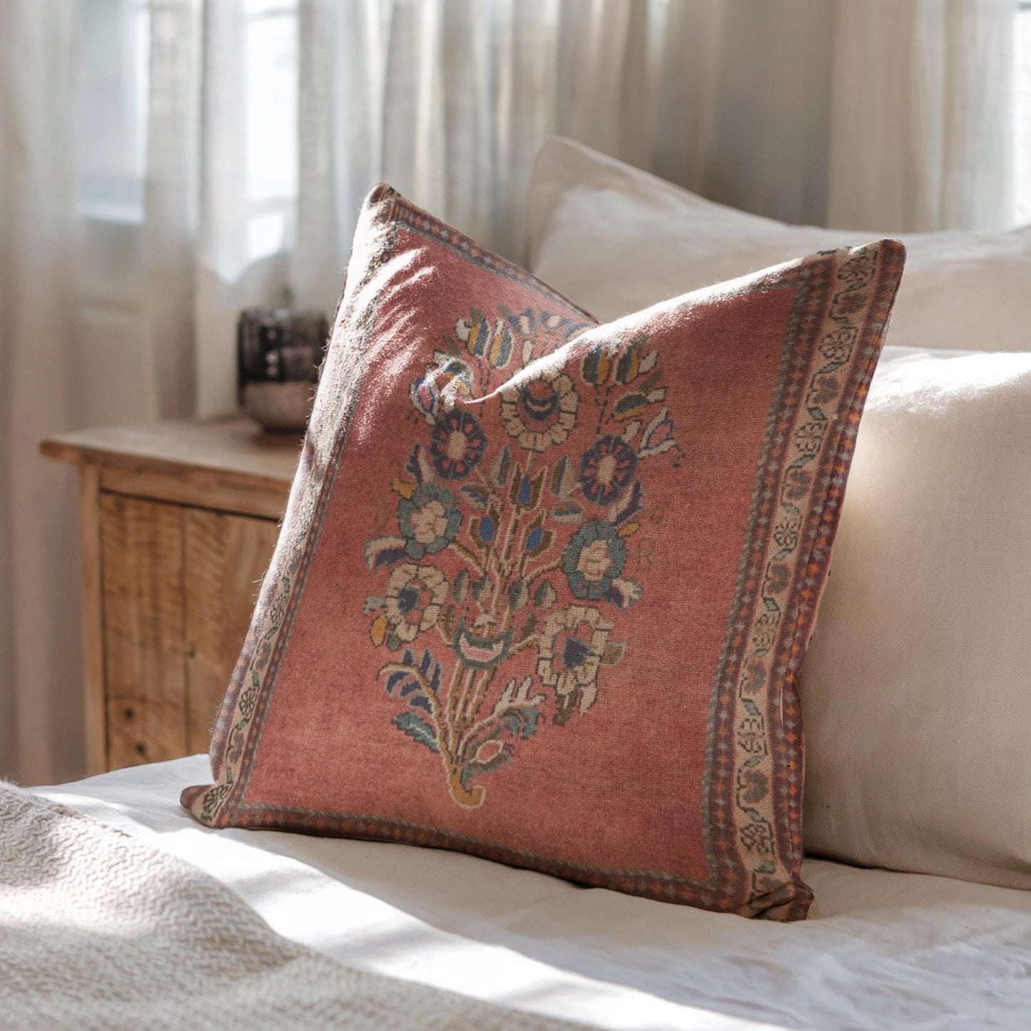 Anatolian Inspired throw pillow with floral pattern styled on a sofa or bed