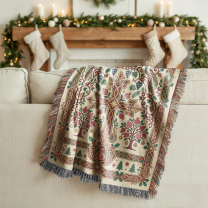 Armenian pomegranate Christmas blanket draped over a cream sofa below a mantel with stockings and garland