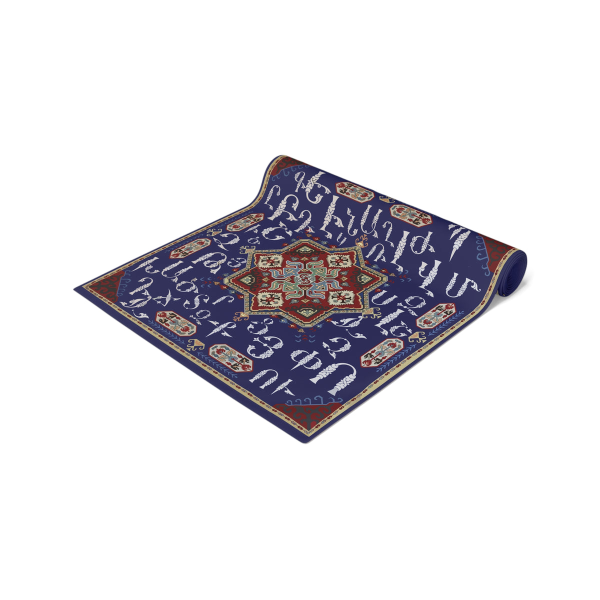 Armenian alphabet table runner in deep blue on a dining table set with white plates and glasses