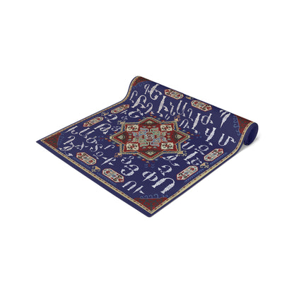 Armenian alphabet table runner in deep blue on a dining table set with white plates and glasses