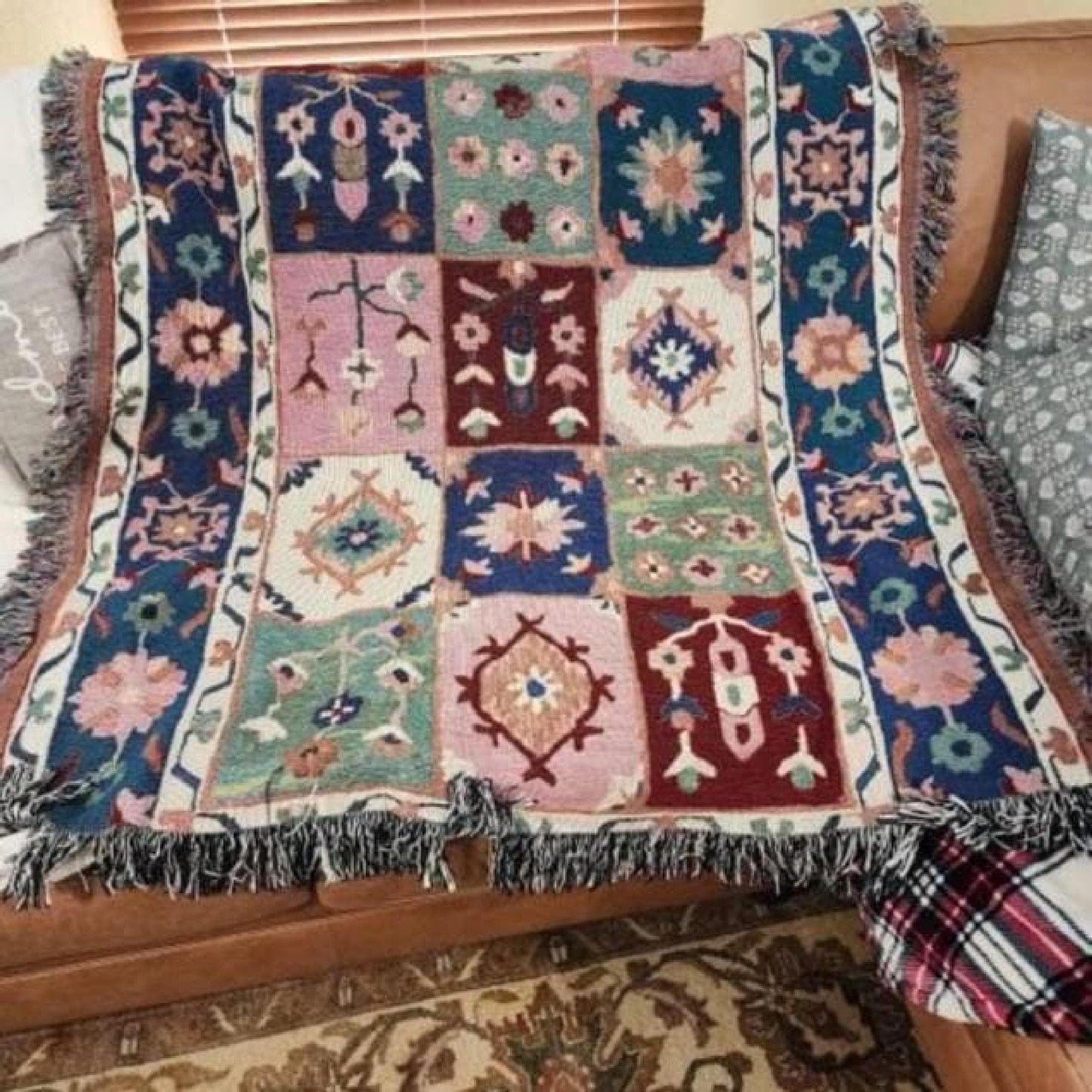 Anatolian Inspired woven blanket with floral pattern styled for layered home decor