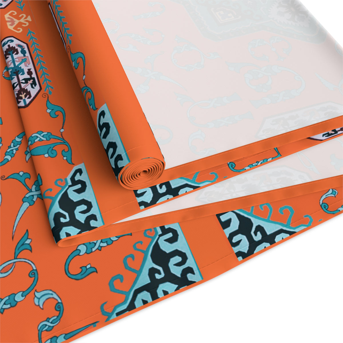 Orange and turquoise Armenian alphabet table runner shown on a dining table