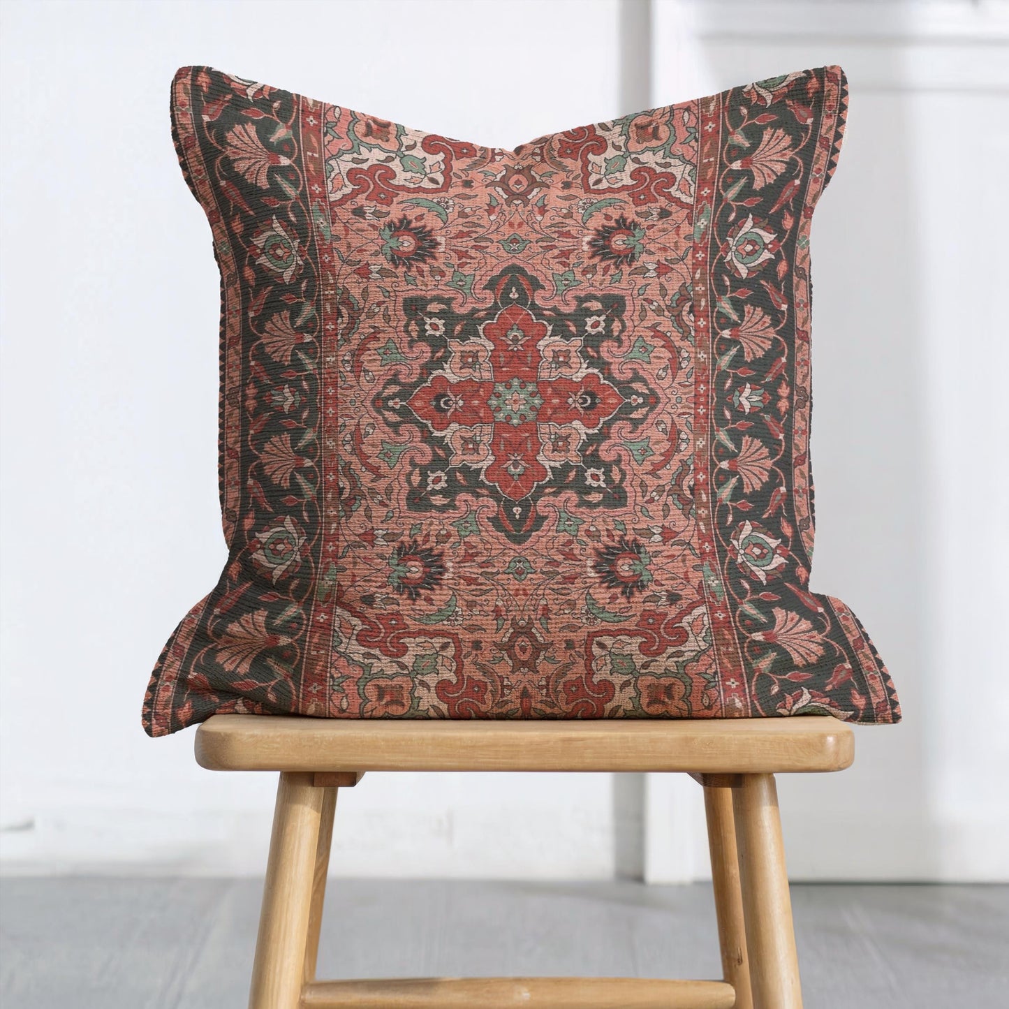 Anatolian Inspired throw pillow with rug-style pattern styled on a sofa or bed