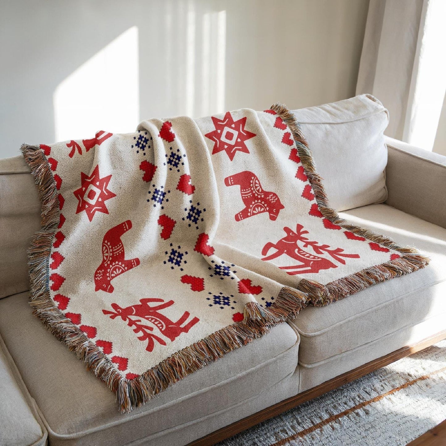 Scandinavian Inspired woven blanket with rug-style pattern styled for layered home decor