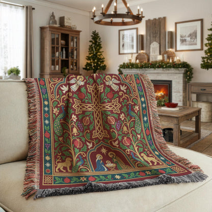 Armenian Christmas woven cotton blanket with fringe. A large central cross is framed by pomegranate branches, stars and doves, with a small Nativity scene below. Armenian Christmas lettering sits at the top of the burgundy design, surrounded by green, blue and muted gold borders.