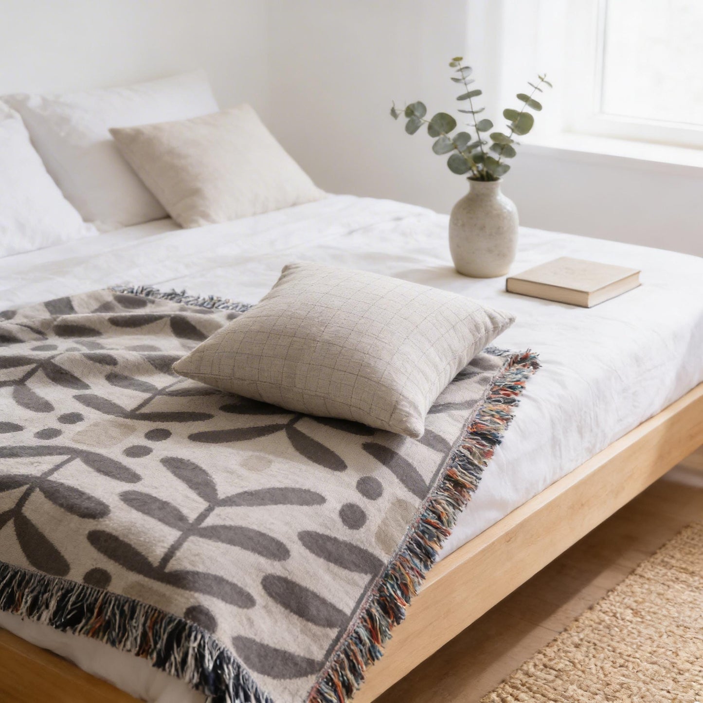 Scandinavian Inspired woven blanket with woven pattern styled for layered home decor