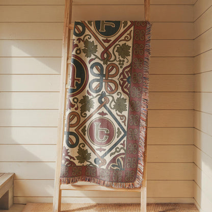 Armenian letter wall tapestry in rust and teal, close view of the woven cotton design