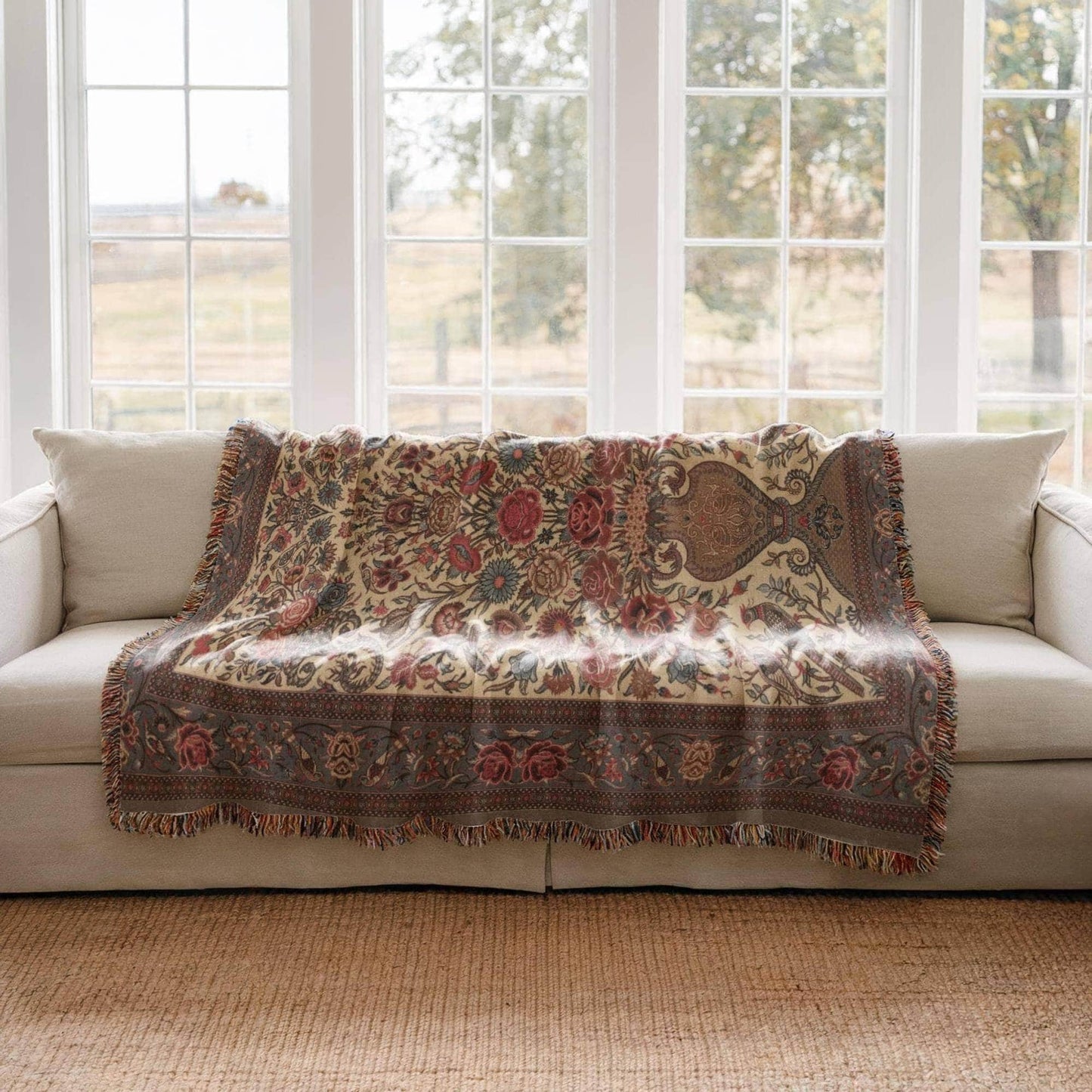 Moroccan Inspired woven blanket with floral pattern styled for layered home decor