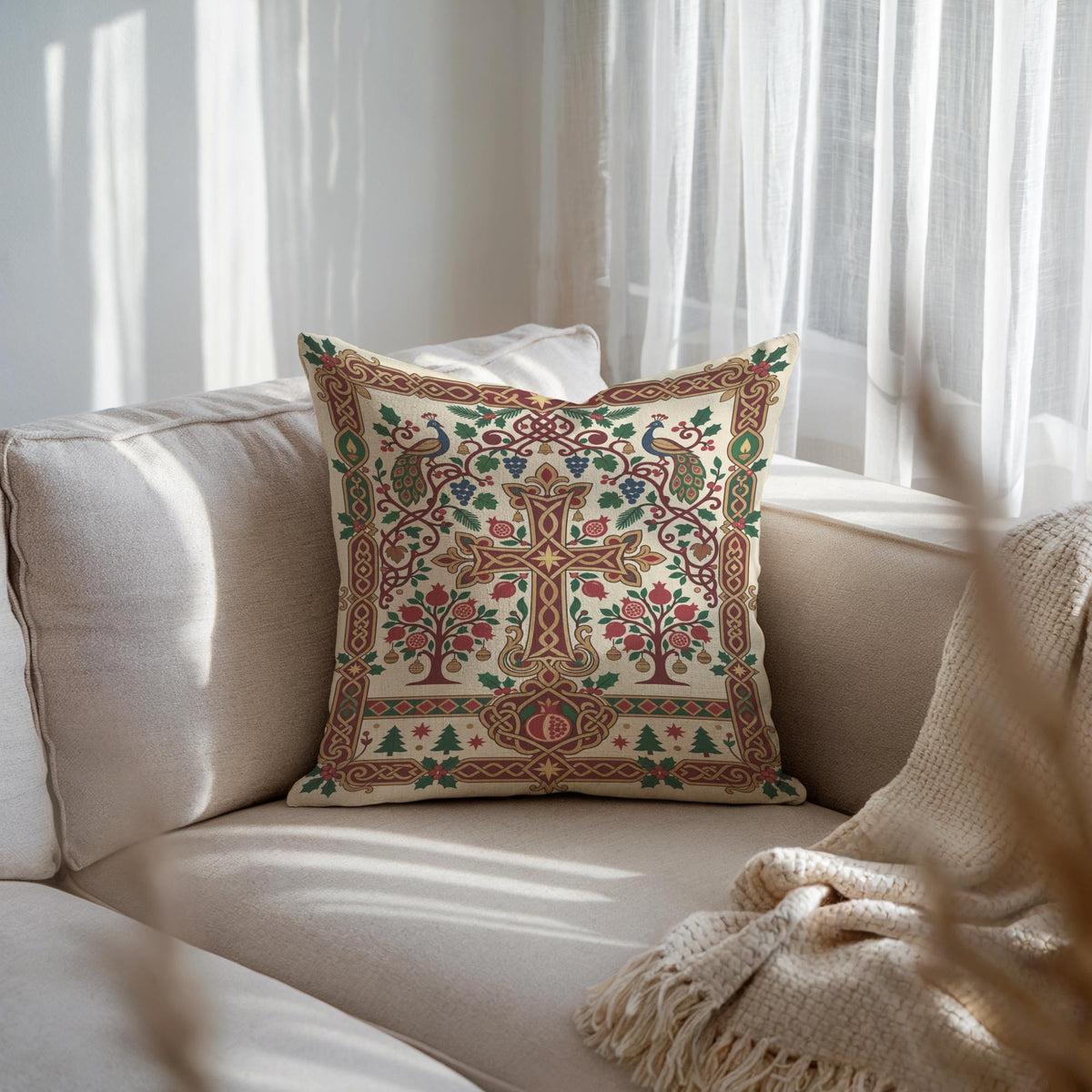 Armenian Christmas woven pillow with cross and tree design on a beige sofa with a white throw over the armrest