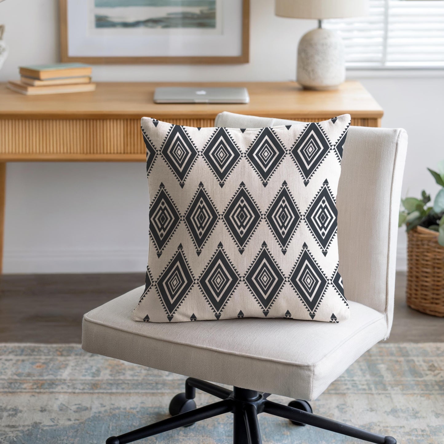 Southwestern throw pillow with geometric pattern styled on a sofa or bed