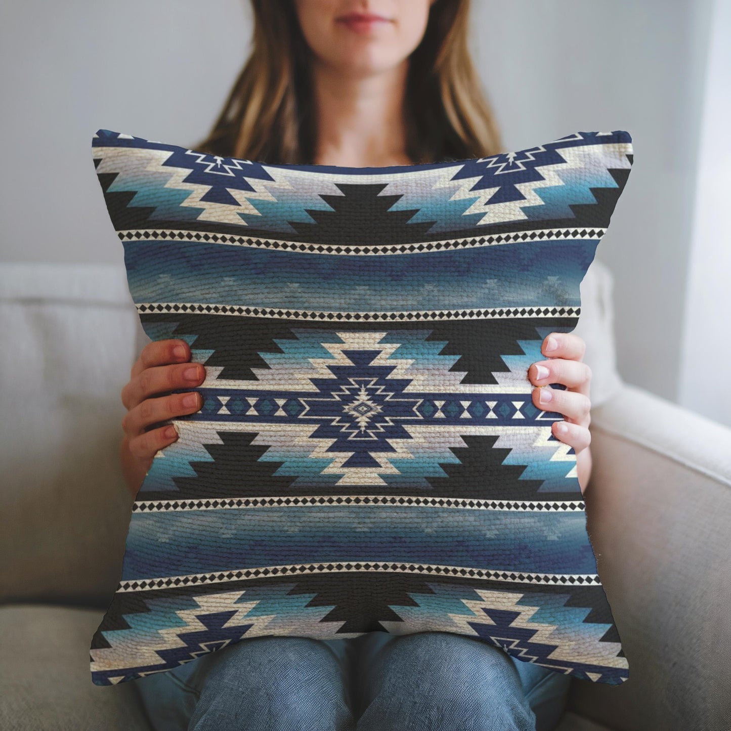 Southwestern throw pillow with geometric pattern styled on a sofa or bed