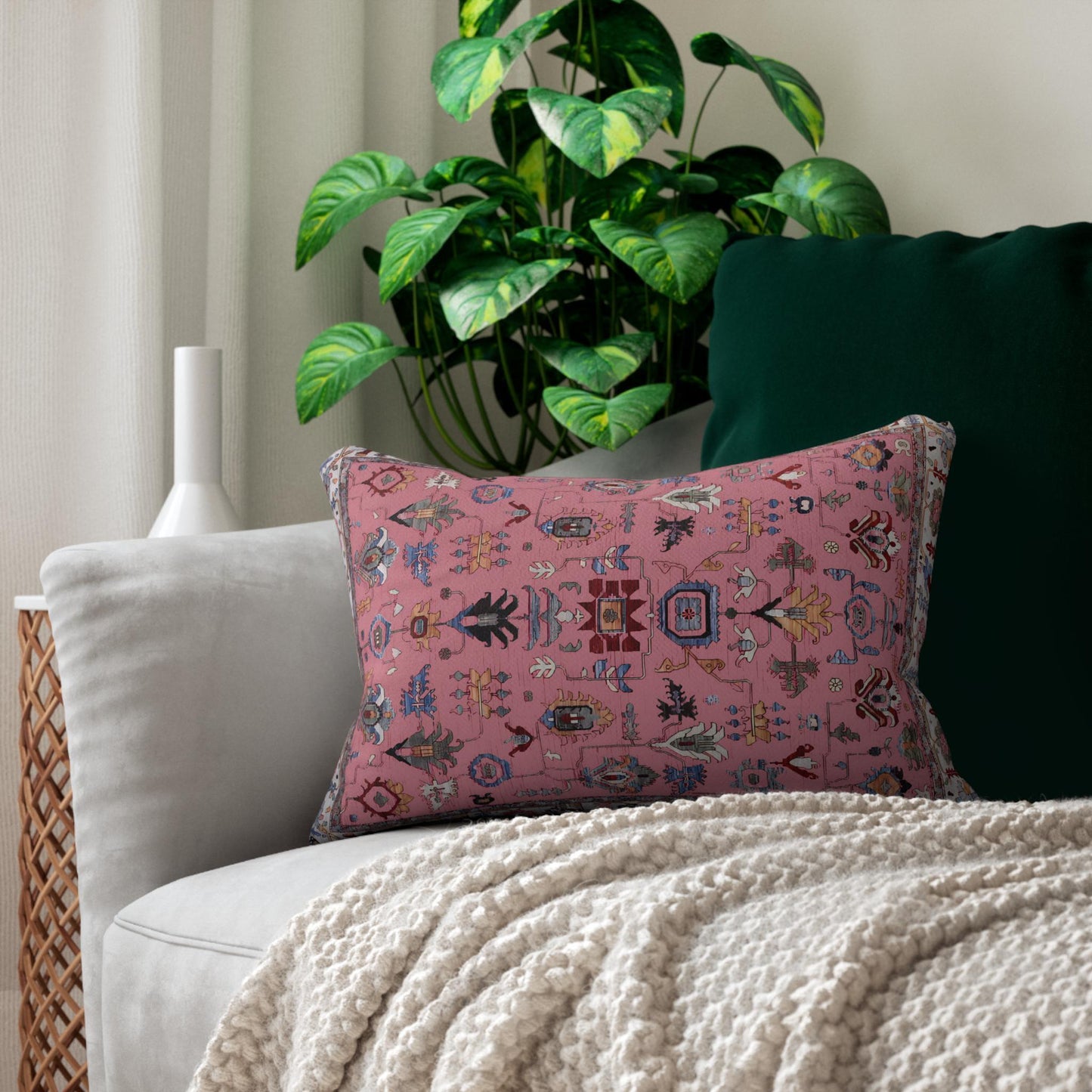 Anatolian Inspired throw pillow with rug-style pattern styled on a sofa or bed
