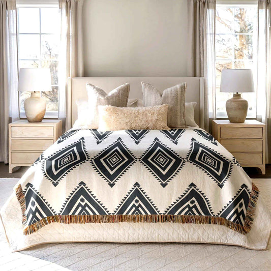 Southwestern woven blanket with geometric pattern styled for layered home decor