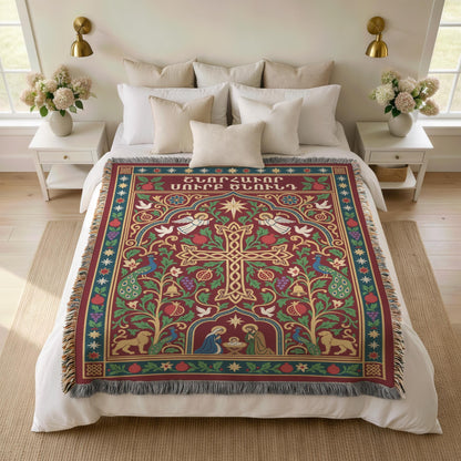 Armenian cross and Nativity blanket over a bed with white pillows and flowers on the nightstands