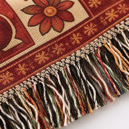Close-up of the Autumn Family weave and fringed edge in red, gold and orange