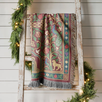 Armenian cross and Nativity Christmas woven cotton throw shown in a styled room setting