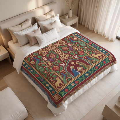 a bedroom with a large bed covered in a colorful, intricately designed blanket featuring a Christmas tree and various holiday-themed elements.