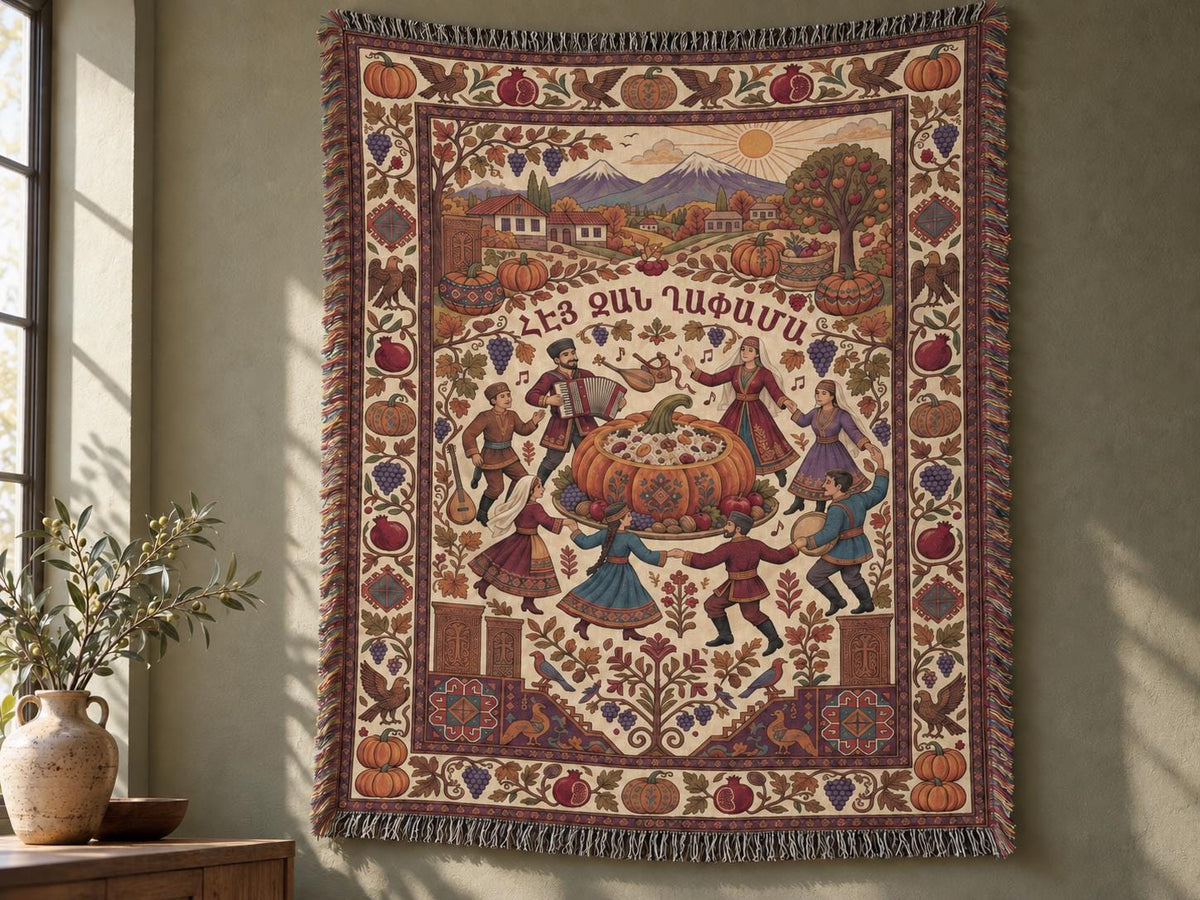Armenian Ghapama cotton blanket displayed as a wall tapestry, with folk dancers around a stuffed pumpkin, a mountain village and muted burgundy harvest border.