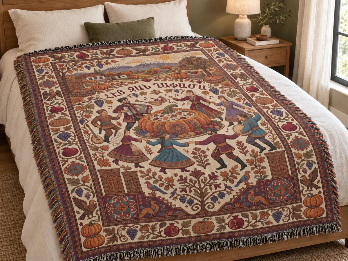 Ghapama dancers woven cotton blanket spread across a bed, showing the pumpkin celebration, cream background, harvest border and fringed edges.