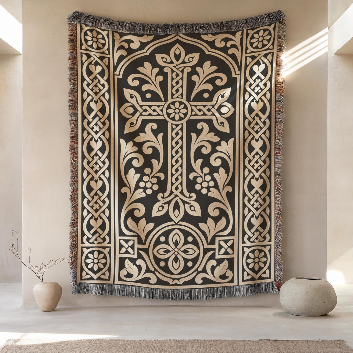 Khachkar woven wall hanging in black and cream, a flared cross rising from a round rosette