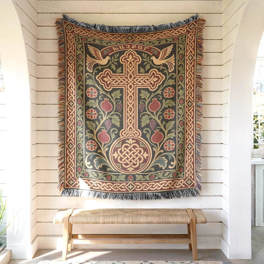 Armenian khachkar wall tapestry hung on white shiplap above a wooden bench