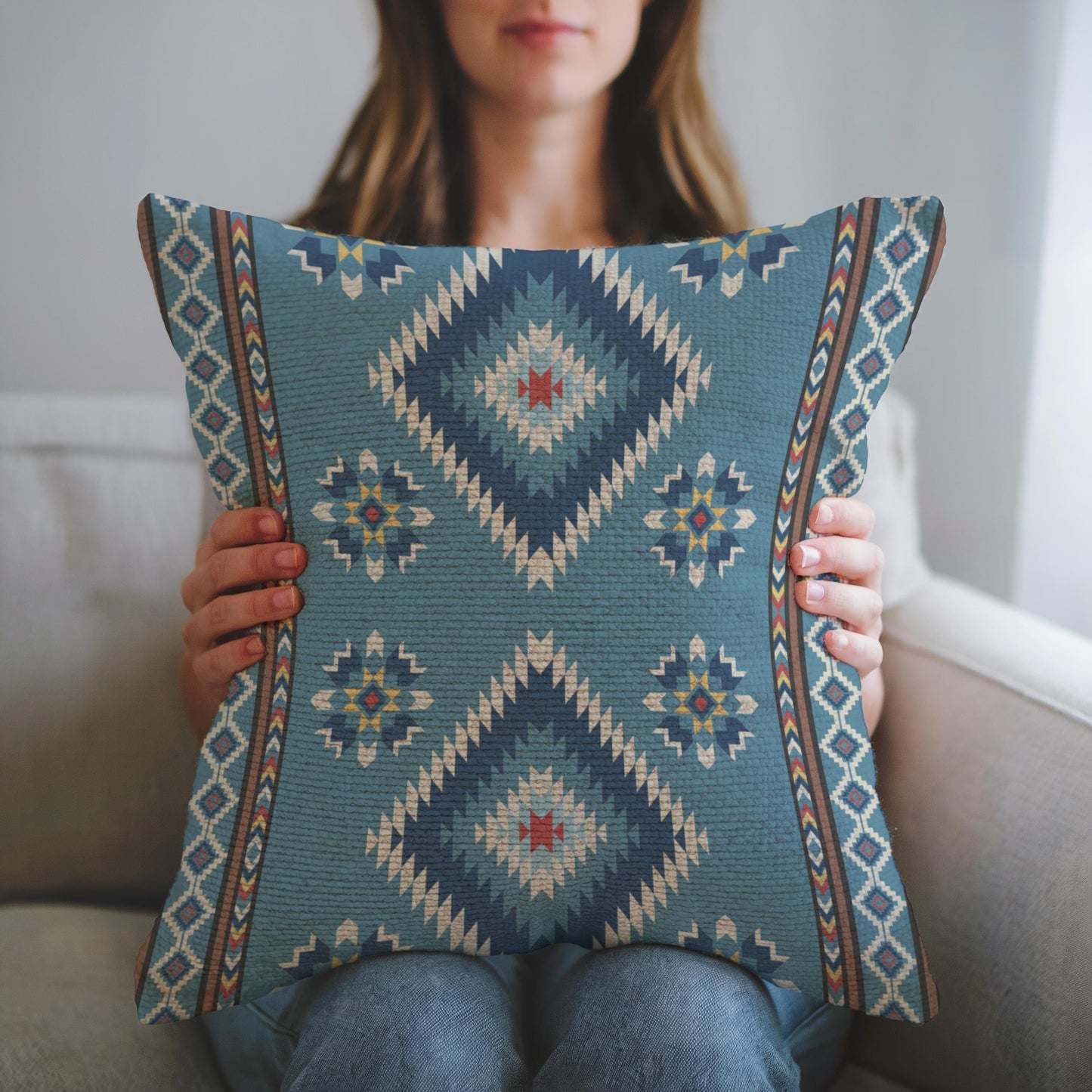 Southwestern throw pillow with geometric pattern styled on a sofa or bed