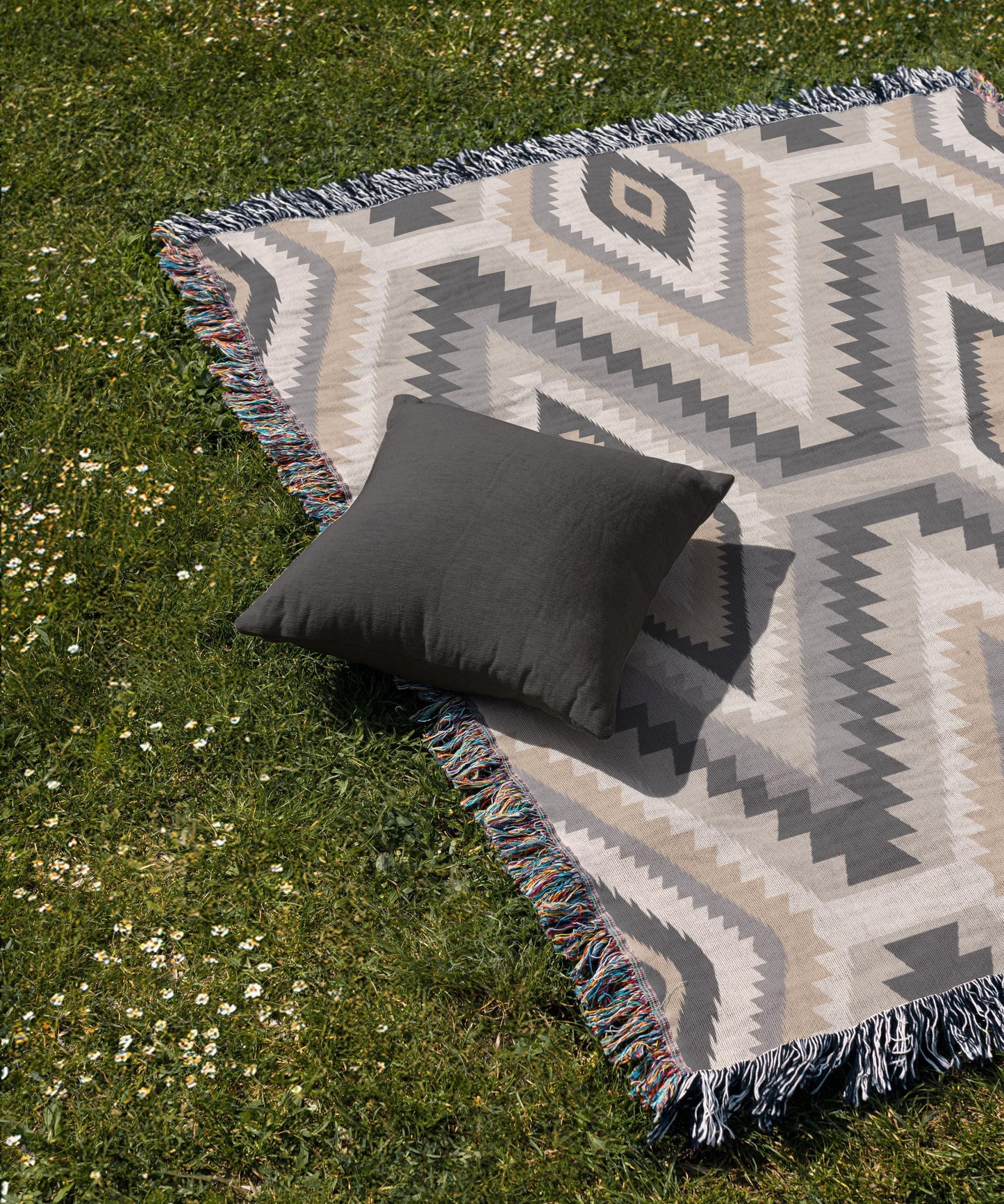 Southwestern woven blanket with geometric pattern styled for layered home decor