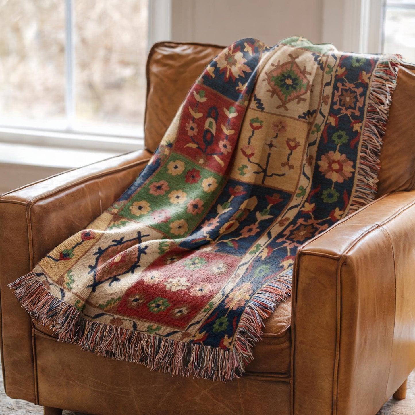 Anatolian Inspired outdoor woven throw blanket with floral pattern for patio styling
