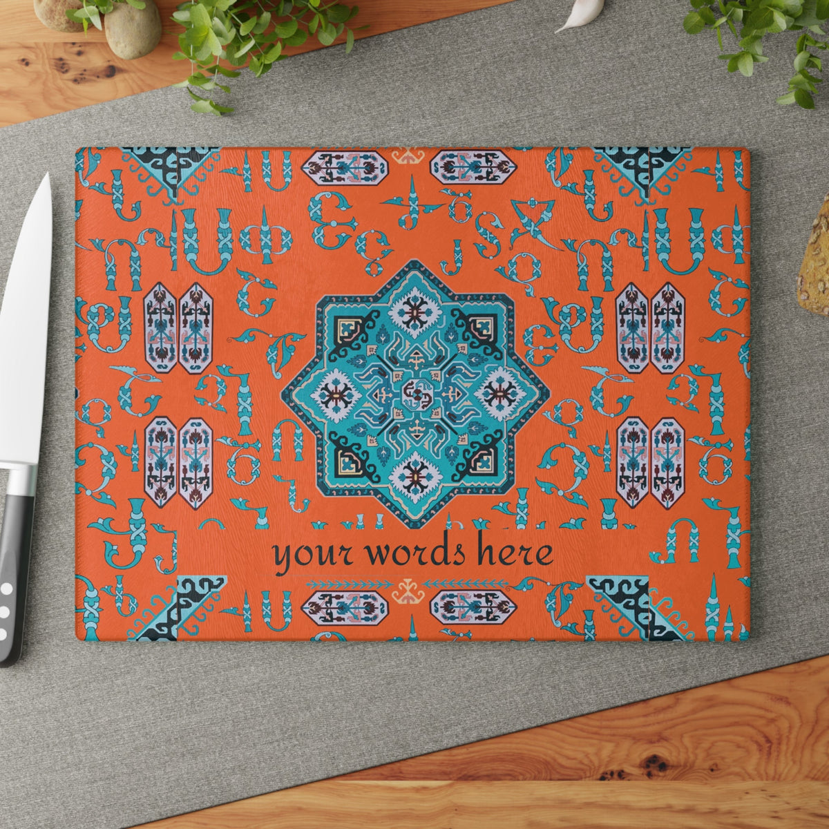 Armenian glass cutting board in orange and turquoise with a personalized line of text