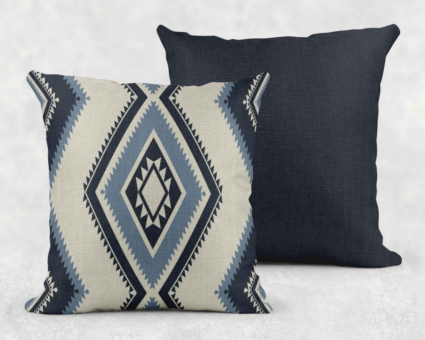 Southwestern pillow cover with geometric pattern styled on a sofa or bed